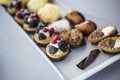 Small cakes and sweets served on a white plate - Italian style