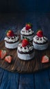 Small cakes topped with chocolate frosting and strawberries, complimentary Royalty Free Stock Photo