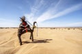 Small camel toy standing on sands of Sahara desert, Africa