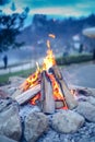 Small camp fire with a pile of wood at Bled Royalty Free Stock Photo