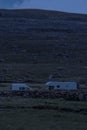 Camper vans at night by a mountain Royalty Free Stock Photo