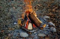 Small campfire with gentle flames in the daylight - perfect for wallpaper