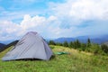 Small camping tent in mountains Royalty Free Stock Photo