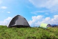 Small camping tents in mountains