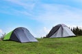 Small camping tents in mountains