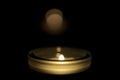 Small candle burning in the dark Royalty Free Stock Photo