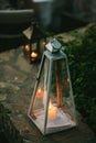 Small candle burning inside a vintage lantern Royalty Free Stock Photo