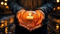A small candle holding by human hands like heart Royalty Free Stock Photo