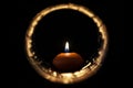 Candle inside light circle in the dark