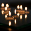 Small candles with steady flames are Royalty Free Stock Photo