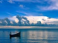 a small canoe on the calm sea in Sampang Madura