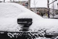 A small car covered with snow on the edge of the ancient city wall Royalty Free Stock Photo