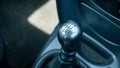 Small car generic 5 gear gearbox stick closeup detail, nobody. Car manual transmission mechanism five gears gear box handle up