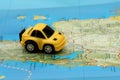 Small car on map Royalty Free Stock Photo