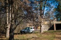 Small car parked in the forest Royalty Free Stock Photo