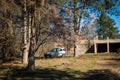 Small car parked in the forest Royalty Free Stock Photo