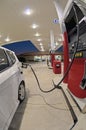 Small Car Refueling At Gasoline Station Convenience Store Revised Royalty Free Stock Photo