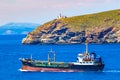 Small cargo ship near Saronic Gulf coast Attica peninsula Greece Royalty Free Stock Photo