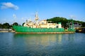 Small cargo ships moored at the harbor.