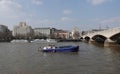 Small cargo vessel MV Anita on the River Thames by Waterloo Bridge