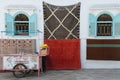 A small carpet vendor in the village of Asilah, Morocco.