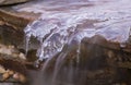 Icicles and flowing water on a waterfall