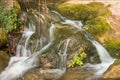 Small cascade in wild natural stream. Royalty Free Stock Photo