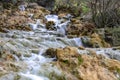 Small cascades of waterfalls on a mountain stream in the spring. Parod River. Israel Royalty Free Stock Photo