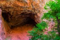 Cave Formed In The Red Limestone Walls