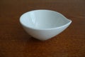 Small ceramic bowl on wooden table