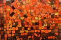 Small ceramic mosaic. Abstract background, glossy texture of mosaic tiles on the wall. Custom-sized red mosaic tiles Royalty Free Stock Photo