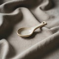A small ceramic spoon rests on Royalty Free Stock Photo