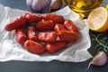 Small cervelat sausages on black background Royalty Free Stock Photo