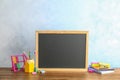 Small chalkboard and different school stationery