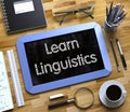 Small Chalkboard with Learn Linguistics Concept. 3D. Royalty Free Stock Photo