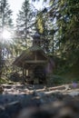 Small chapel in the forest in germany bavarian forest - Osserkapelle on the Osser. With heavy lensflare. Royalty Free Stock Photo