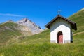 Small chapel on green alpine meadow in France Royalty Free Stock Photo