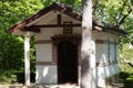 Small chapel in sunlight in the forest Royalty Free Stock Photo