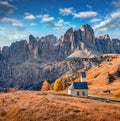 Small chapel on the top of Gardena pass with Piz Boe mountain on background.