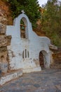 Small chapel at Voulismeni lake at Greek town Agios Nikolaos at Royalty Free Stock Photo