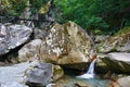 Small charming waterfall in mountain forest