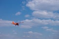 Small charter aircraft flying in a blue sky