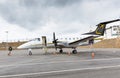 Small Charter Propeller engine airplane sitting on the tarmac at local airport