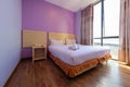 Small and cheap hotel bedroom Royalty Free Stock Photo