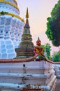 The small chedi and Yaksha statue, Wat Ket Karam, Chiang Mai, Thailand Royalty Free Stock Photo