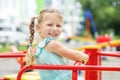 A small cheerful child walks on the playground. The concept of childhood, lifestyle, upbringing, kindergarten.