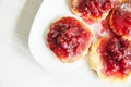 Small cheesecakes with raspberry jam Royalty Free Stock Photo
