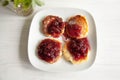 Small cheesecakes with raspberry jam Royalty Free Stock Photo