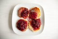 Small cheesecakes with raspberry jam Royalty Free Stock Photo