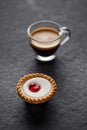 Small cherry cake with a glass of fresh espresso Royalty Free Stock Photo